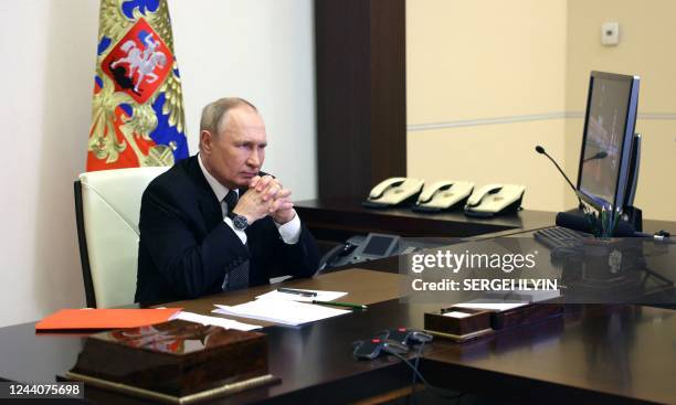 Russian President Vladimir Putin chairs a Security Council meeting via a video link at the Novo-Ogaryovo state residence outside Moscow on October...