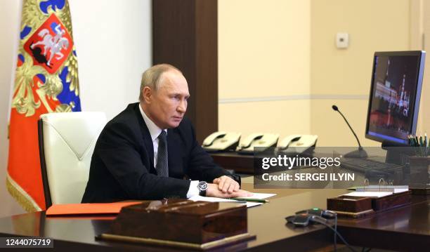 Russian President Vladimir Putin chairs a Security Council meeting via a video link at the Novo-Ogaryovo state residence outside Moscow on October...