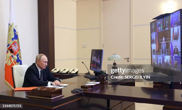 Russian President Vladimir Putin chairs a Security Council meeting via a video link at the Novo-Ogaryovo state residence outside Moscow on October...