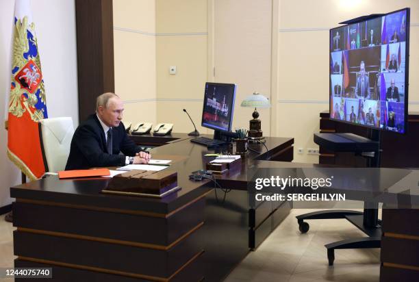 Russian President Vladimir Putin chairs a Security Council meeting via a video link at the Novo-Ogaryovo state residence outside Moscow on October...