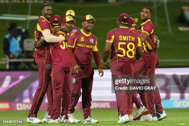 West Indies' players celebrate their victory in the ICC mens Twenty20 World Cup 2022 cricket match between West Indies and Zimbabwe at Bellerive Oval...