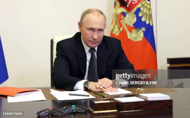 Russian President Vladimir Putin chairs a Security Council meeting via a video link at the Novo-Ogaryovo state residence outside Moscow on October...