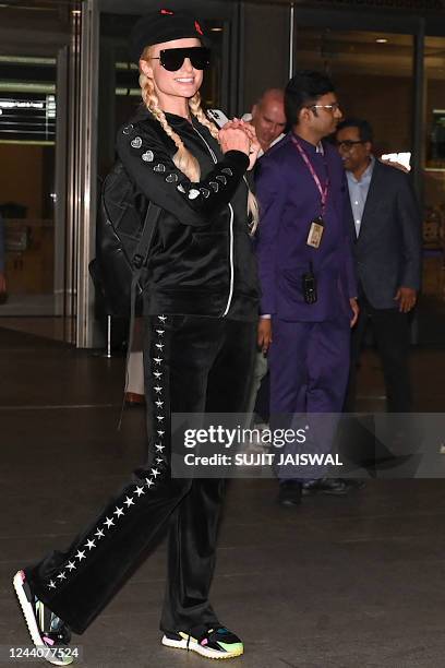 Model and actress Paris Hilton arrives at the airport in Mumbai on October 19, 2022.