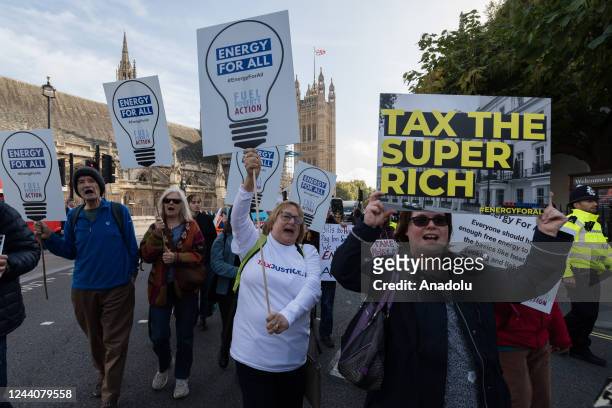 Campaigners from Fuel Poverty Action group, take part in a protest march to Downing Street through Westminster calling on the government to introduce...