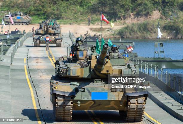 South Korean Army K-2 tanks cross a floating bridge during a South Korea-US joint river-crossing drill as part of the annual Hoguk military exercise...