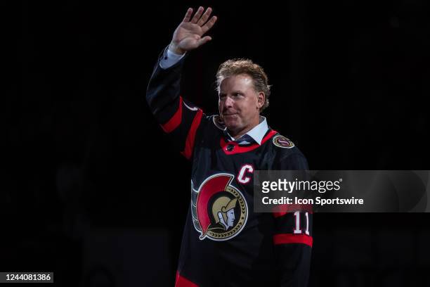 Former Ottawa Senators player Daniel Alfredsson waves to the crowd prior to a ceremonial face-off before National Hockey League action between the...