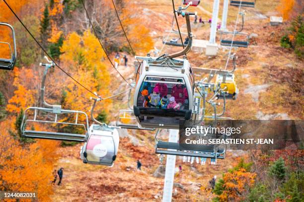 Visitors ride the ski-lift to Mont-Orford in the Mont-Orford National Park near Orford, Quebec, Canada, on October 8, 2022.