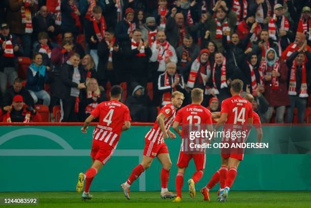 Union Berlin's Polish defender Tymoteusz Puchacz celebrates his 1-0 during the German Cup second round football match between the German first...