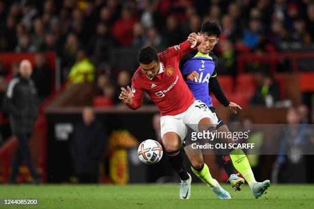 Manchester United's Brazilian midfielder Casemiro fights for the ball with Tottenham Hotspur's South Korean striker Son Heung-Min during the English...