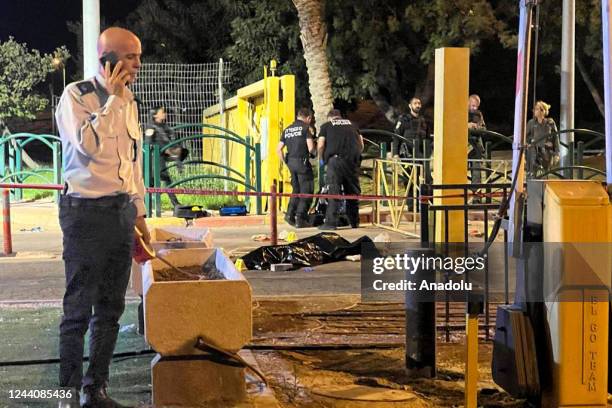 Israeli police officers stand guard at the scene of a shooting attack outside Ma'ale Adumim in East Jerusalem on October 19, 2022. The gunman was...