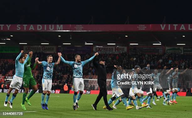 Southampton's Austrian manager Ralph Hasenhuttl joins his players celebrating on the pitch after the English Premier League football match between...