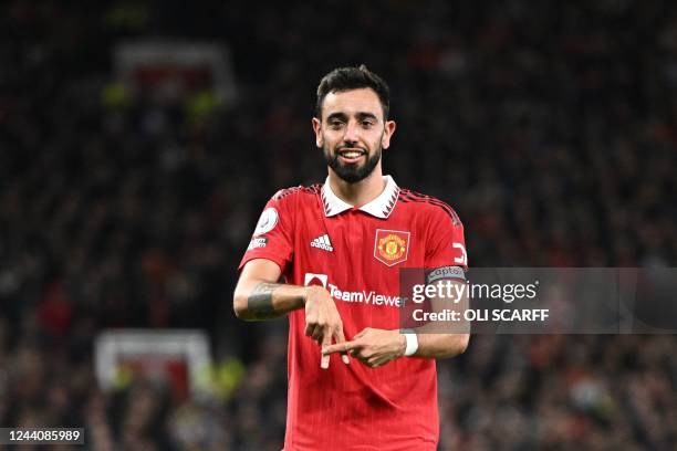 Manchester United's Portuguese midfielder Bruno Fernandes celebrates after scoring his team second goal during the English Premier League football...