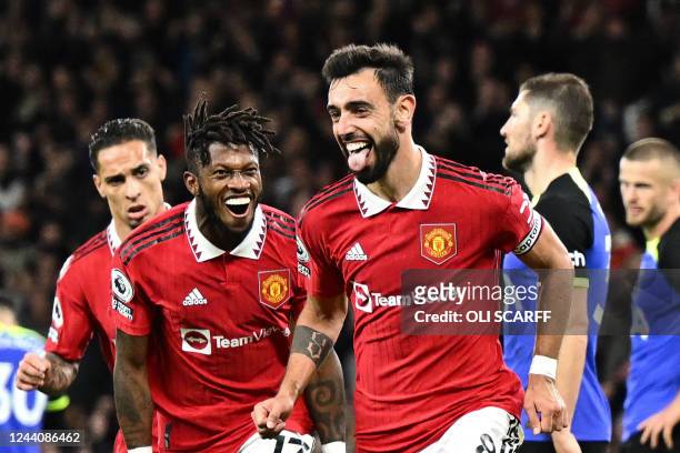 Manchester United's Portuguese midfielder Bruno Fernandes celebrates after scoring his team second goal during the English Premier League football...