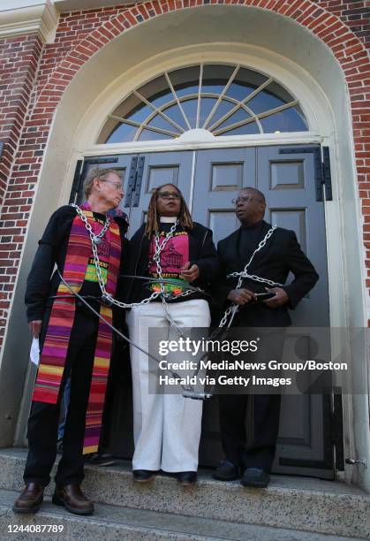 Rev. John Gibbons, Arlington St church, Rev Valerie Copeland, Neighborhood Church of Dorchester and Rev. Kevin Peterson chain themselves to the door...