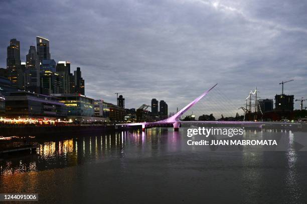 The Puente de la Mujer bridge at Puerto Madero neighbourhood is lit with pink light on the occasion of the International Day against breast cancer in...