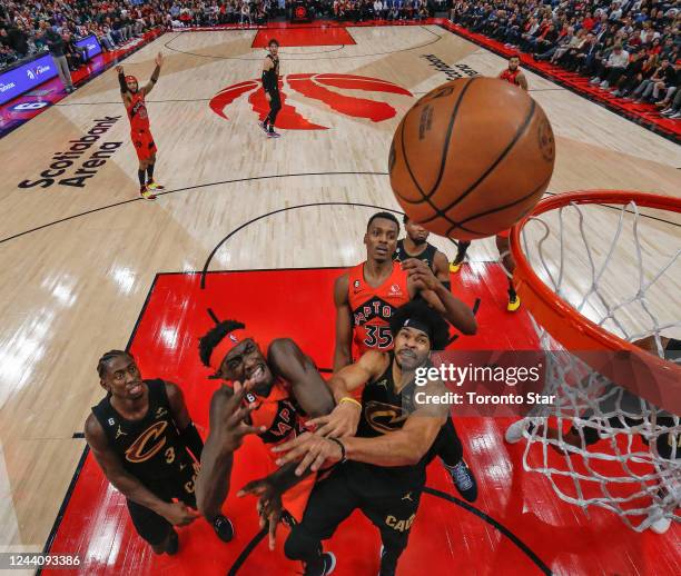 City:UC}, ON Toronto Raptors forward Pascal Siakam crashes the boards against Cleveland Cavaliers center Jarrett Allen as he battles for position...