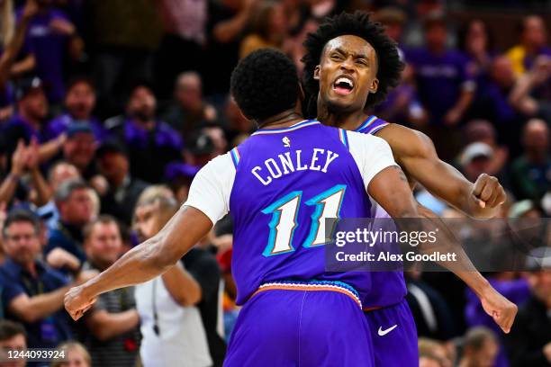 Mike Conley and Collin Sexton of the Utah Jazz celebrate a play against the Denver Nuggets at Vivint Arena on October 19, 2022 in Salt Lake City,...