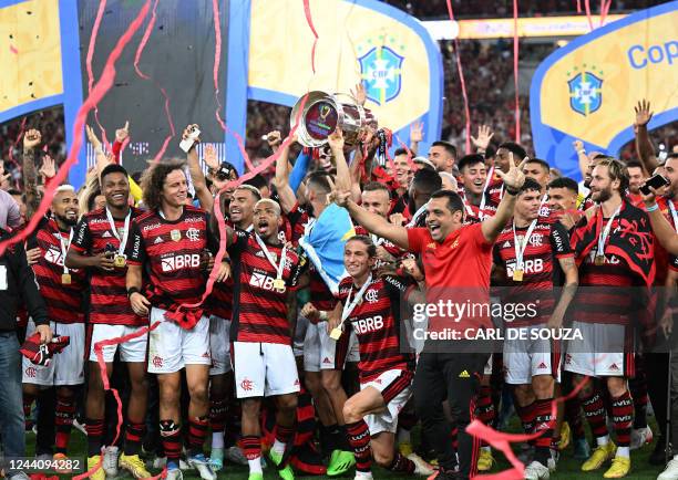 Flamengo's players celebrate after defeating Corinthians by penalty shootout during the Brazil Cup final second leg football match at Maracana...