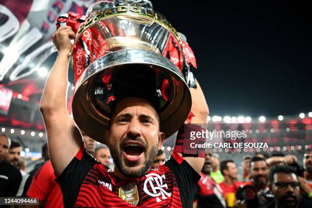Flamengo's Everton Ribeiro holds up the trophy after his team defeated Corinthians by penalty shootout during the Brazil Cup final second leg...