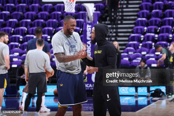 Assistant Coach Darrell Arthur of the Denver Nuggets chats with Mike Conley of the Utah Jazz on October 19, 2022 at Vivint Arena in Salt Lake City,...