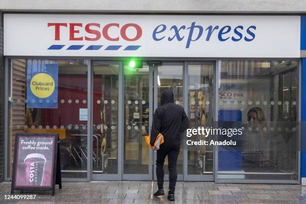 Man walks into a Tesco supermarket as the UK inflation rises to 10.1% due to rising food prices in London, United Kingdom on October 20, 2022.