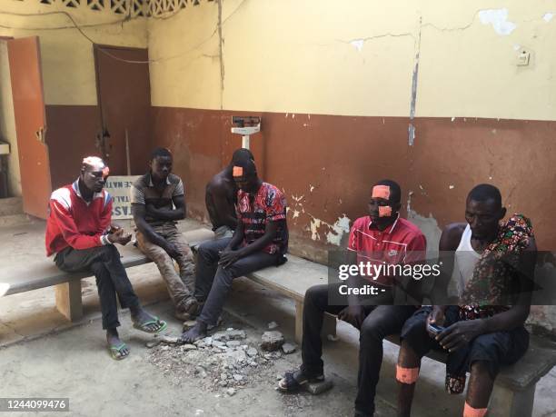 This photograph taken on October 20, 2022 shows injured protesters at the Union de Chagoua hospital during a demonstration in NDjamena. - Clashes...