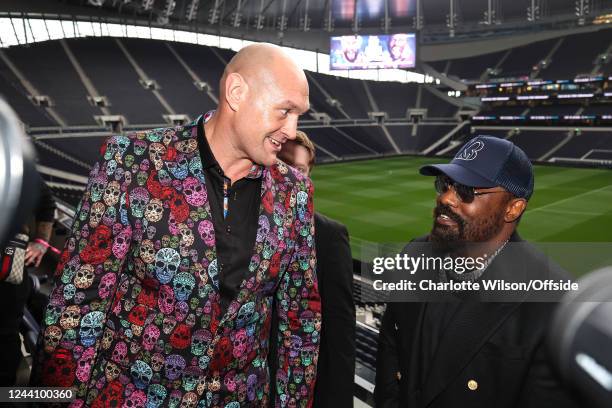 Tyson Fury and Derek Chisora stand out on the balcony at the Tottenham Hotspur Stadium during the Tyson Fury Press Conference at Tottenham Hotspur...