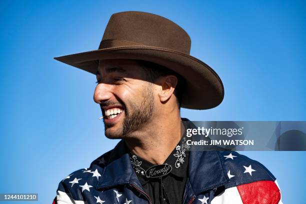 McLarens Australian driver Daniel Ricciardo arrives in the paddock during the Formula One United States Grand Prix preview day, at the Circuit of the...