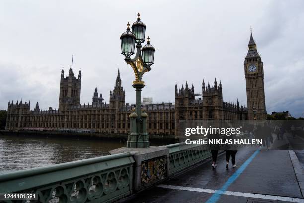 Photograph taken on October 20, 2022 shows the Palace of Westminster, house of Parliaments and Elizabeth Tower, commonly referred to as Big ben, in...