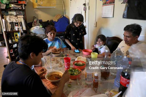 Magdalena Garcia second from left, mother of six children, has dinner with children Jesse Davila far left, Angie Davila Yaretzi Galicia and husband...