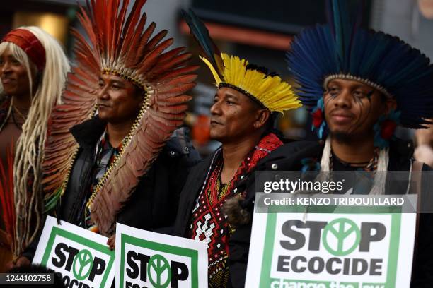 Brazilian indigenous and other militants take part in a demonstration called by Stop Ecocide International for the recognition of ecocide as an...