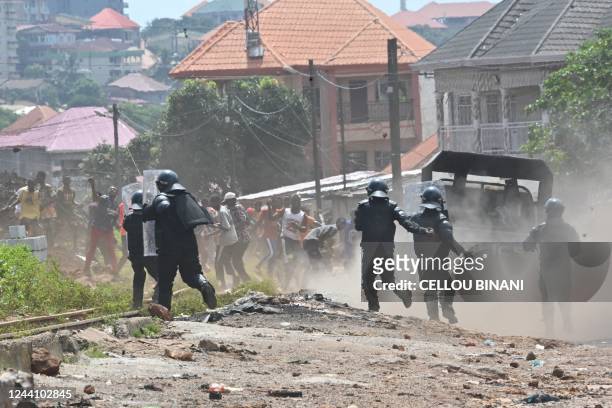 Riot police run to disperse protestors after the outlawed opposition group, The National Front for the Defence of the Constitution , called for...