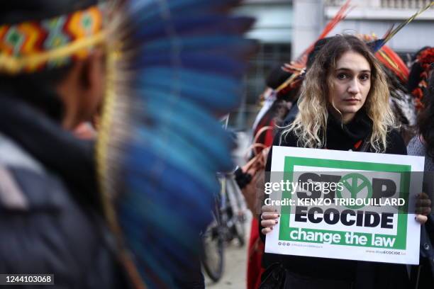 Brazilian indigenous and other militants take part in a demonstration called by Stop Ecocide International for the recognition of ecocide as an...