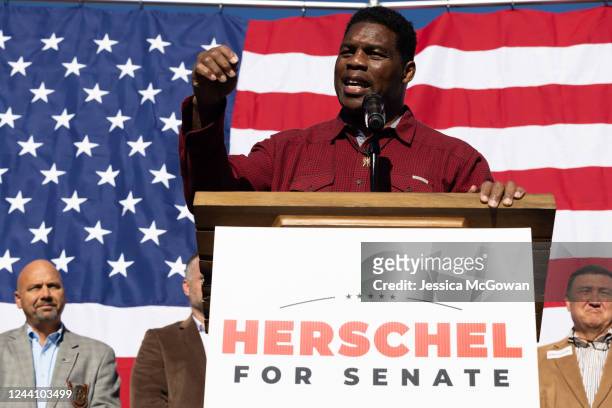 Georgia Republican Senate nominee Herschel Walker addresses the crowd of supporters during a campaign stop on October 20, 2022 in Macon, Georgia....