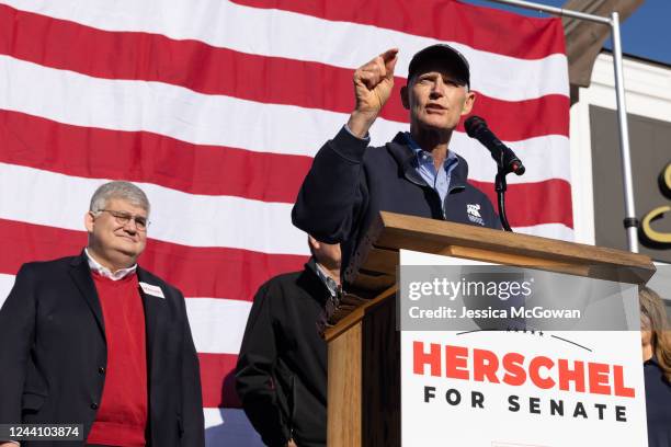 Senator Rick Scott addresses the crowd while campaigning for Georgia Republican Senate nominee Herschel Walker during an event on October 20, 2022 in...