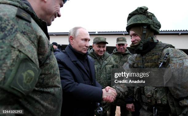 Russian President Vladimir Putin inspects a training ground in the Ryazan region for recruits who were summoned into military service under a partial...