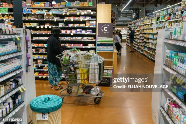 Shoppers are seen at Whole Foods Market on October 14 in Atlanta, Georgia. - Economic prospects are becoming "more pessimistic" in the United States...