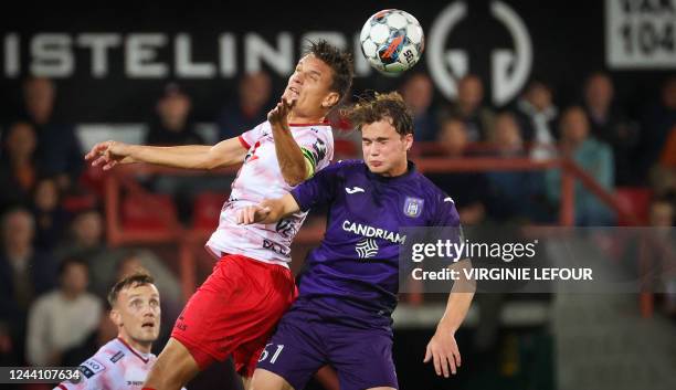 Essevee's Jelle Vossen and Anderlecht's Frederik Kristian Arnstad fight for the ball during a soccer match between SV Zulte Waregem and RSC...