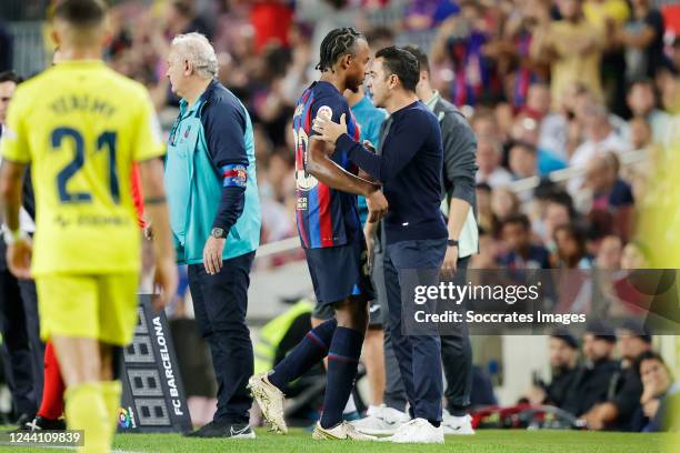 Jules Kounde of FC Barcelona coach Xavi Hernandez of FC Barcelona during the La Liga Santander match between FC Barcelona v Villarreal at the Spotify...