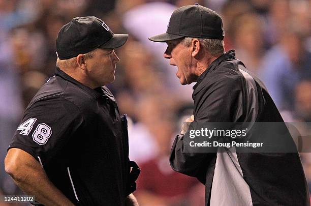 Manager Jim Tracy of the Colorado Rockies has words with homeplate umpire Mark Carlson after Carlson ejected Carlos Gonzalez of the Colorado Rockies...