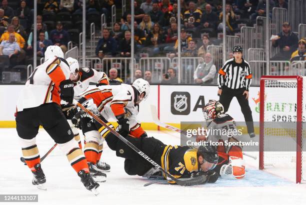 Boston Bruins left wing Taylor Hall crashes into Anaheim Ducks goalie John Gibson during a NHL game between Anaheim Ducks and Boston Bruins on...