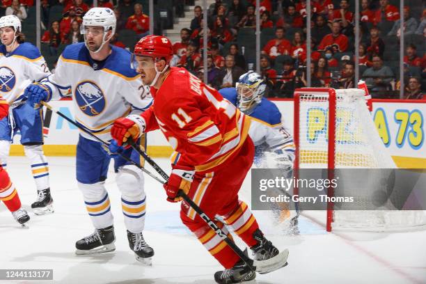 Mikael Backlund of the Calgary Flames skates up ice against the Buffalo Sabres at Scotiabank Saddledome on October 20, 2022 in Calgary, Alberta,...