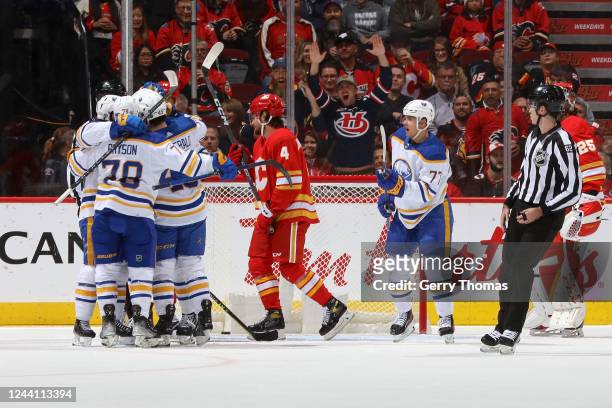 The Buffalo Sabres celebrate on ice after a goal against the Calgary Flames at Scotiabank Saddledome on October 20, 2022 in Calgary, Alberta, Canada.