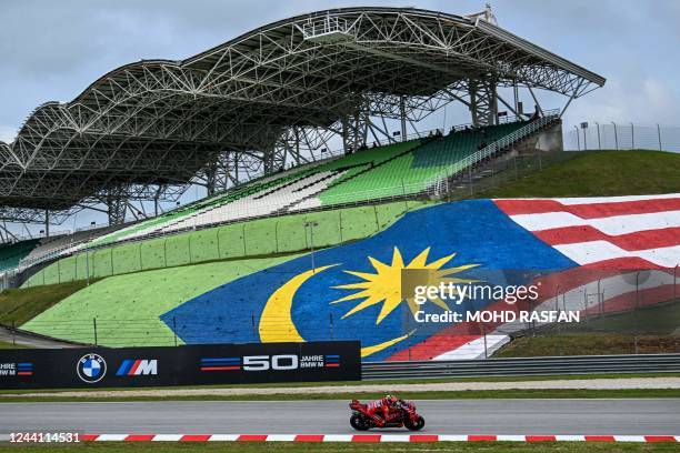 Ducati Lenovo Team's Italian rider Francesco Bagnaia steers his bike during the first MotoGP free practice at the Sepang International Circuit on...