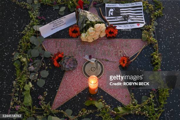 Flowers and signs are placed on the Hollywood Walk of Fame star of late US musician Tom Petty on what would have been his 72nd birthday, in...