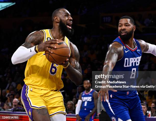 Los Angeles, CA LeBron James of the Los Angeles Lakers controls the ball against Marcus Morris Sr. #8 of the LA Clippers in the first half of a NBA...