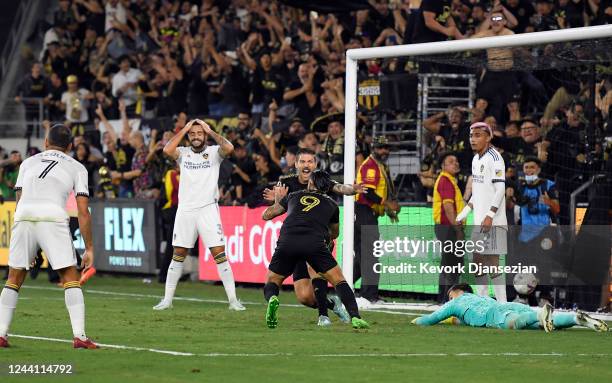 Cristian Arango of Los Angeles FC celebrates with Ryan Hollingshead after scoring the winning goal against Los Angeles Galaxy during the second half...