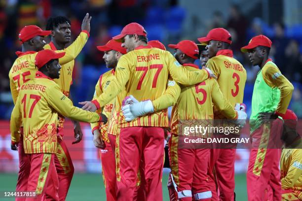 Zimbabwe players celebrate the dismissal of Scotland's George Munsey during the ICC mens Twenty20 World Cup 2022 cricket match between Scotland and...