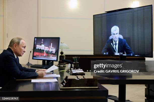 Russian President Vladimir Putin meets with Governor of Magadan Region Sergey Nosov via a video conference call at the Novo-Ogaryovo state residence,...