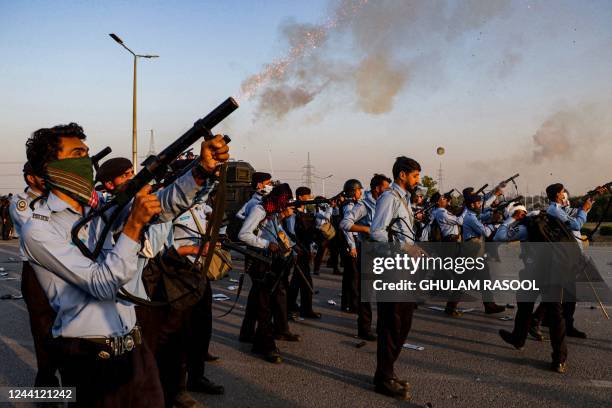 Police use teargas to disperse protestors of Pakistan Tehreek-e-Insaf during a demonstration against the decision to disqualify former prime minister...